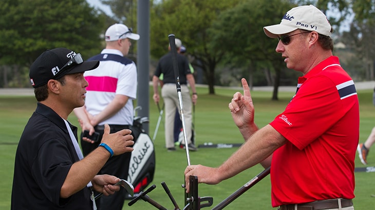 Dino and Team Titleist member Ed change their lie...